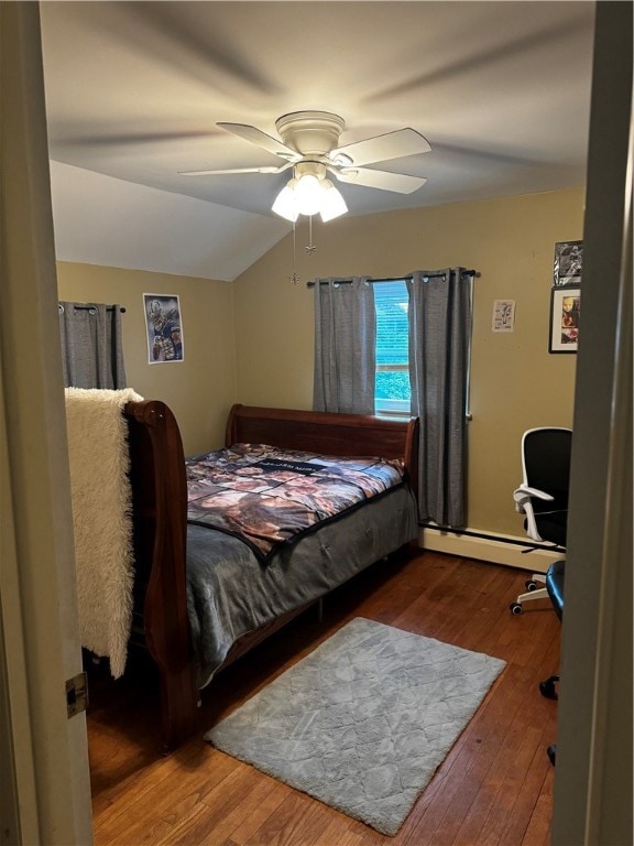 bedroom with ceiling fan, vaulted ceiling, a baseboard radiator, and hardwood / wood-style floors