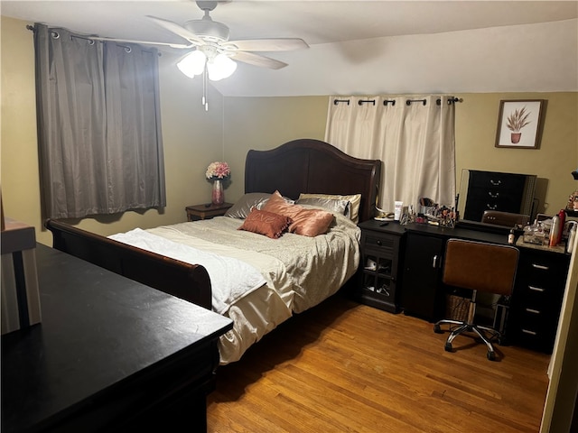 bedroom featuring ceiling fan and hardwood / wood-style flooring