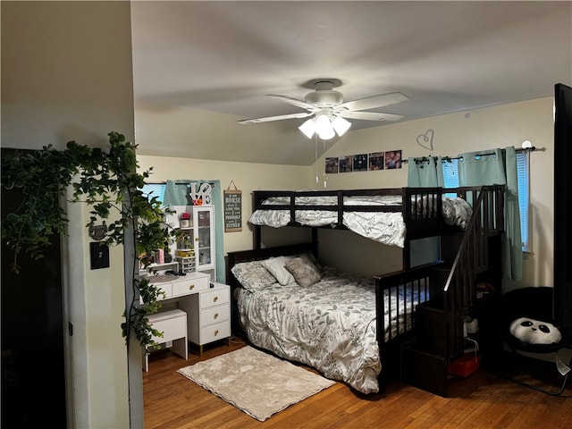 bedroom with wood-type flooring and ceiling fan