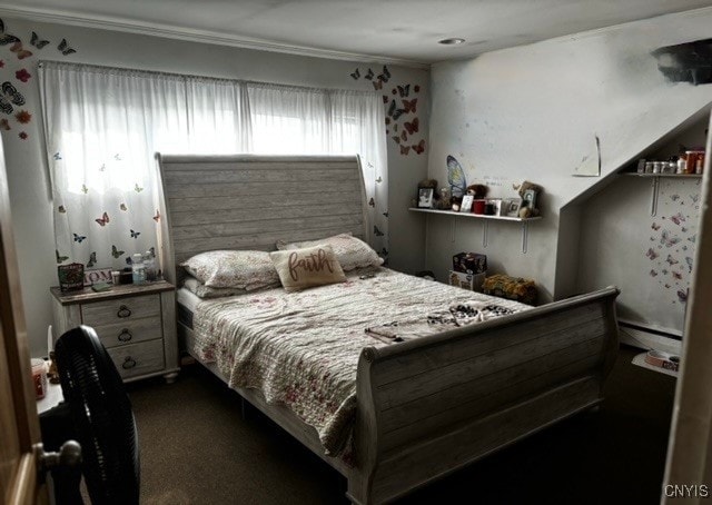 carpeted bedroom featuring ornamental molding and a baseboard radiator