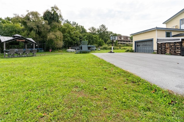 view of yard with a garage