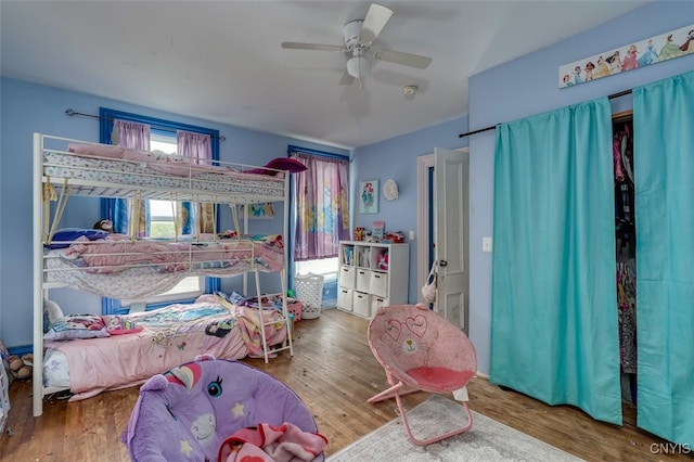 bedroom featuring ceiling fan and wood-type flooring