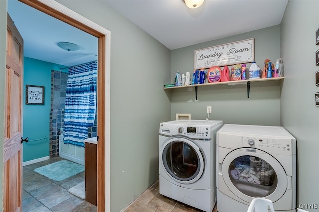 laundry room featuring washing machine and clothes dryer