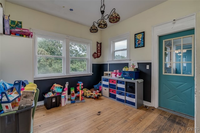 recreation room featuring light wood-type flooring