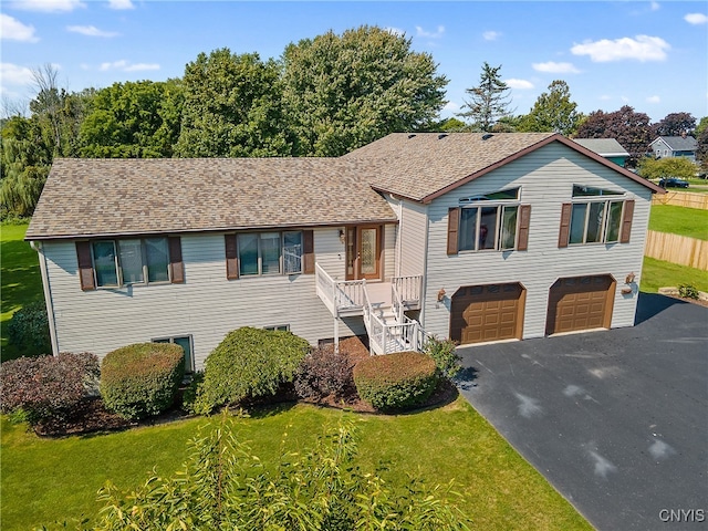 view of front of house featuring a garage and a front yard