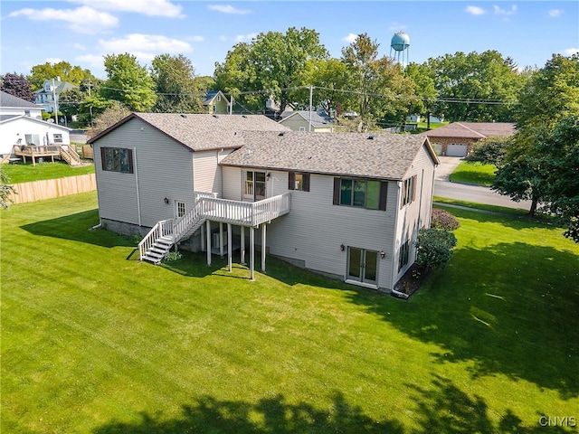 rear view of house with a yard