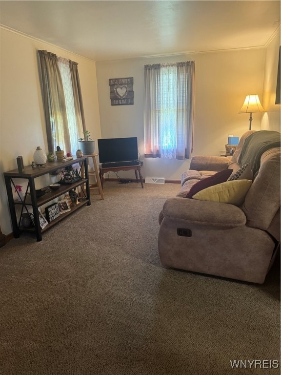 living room with carpet floors and ornamental molding