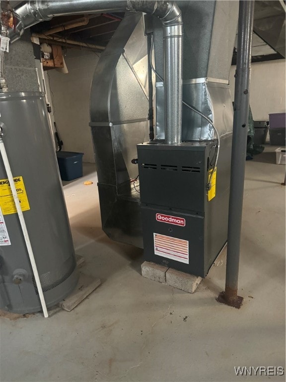 utility room featuring water heater