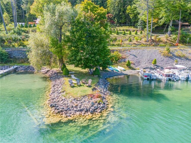 birds eye view of property featuring a water view