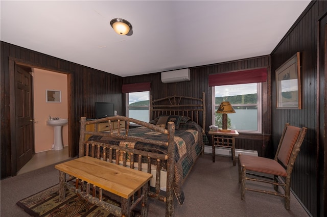 bedroom with wooden walls, a wall mounted AC, sink, and multiple windows