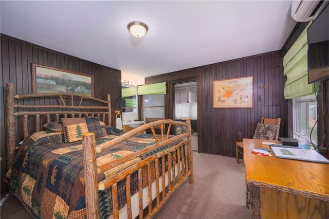 carpeted bedroom featuring wooden walls and a wall mounted AC