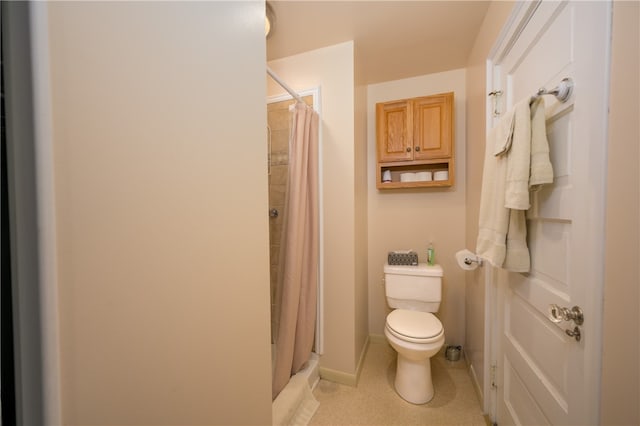 bathroom with walk in shower and toilet