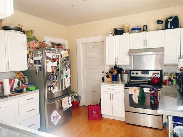 kitchen featuring light wood-type flooring, white cabinetry, and stainless steel appliances