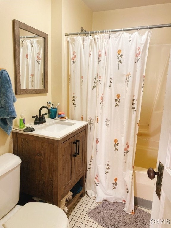 full bathroom with tile patterned flooring, vanity, toilet, and shower / bath combo