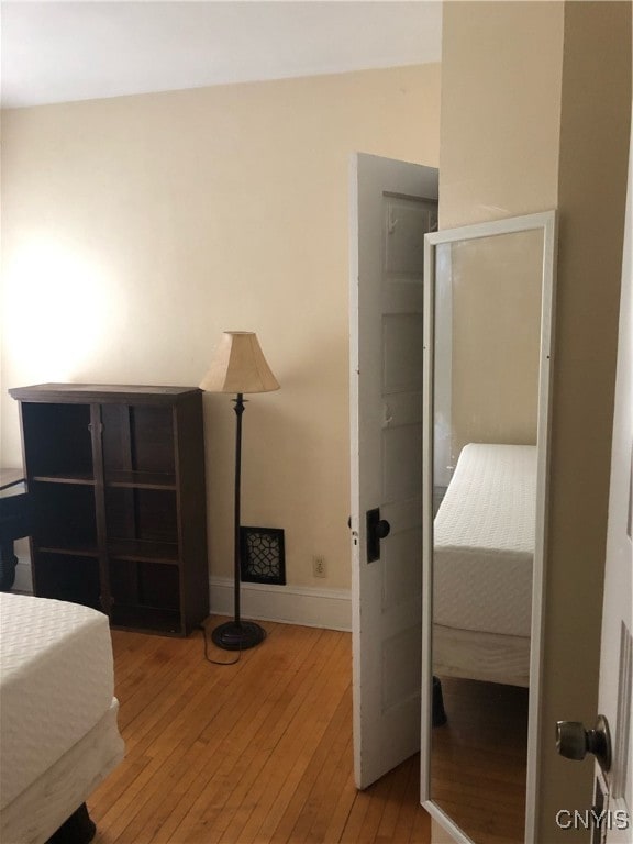 bedroom with light wood-type flooring