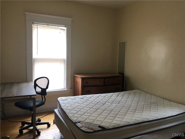 bedroom with light wood-type flooring