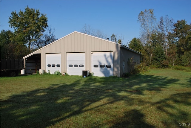 garage featuring a lawn