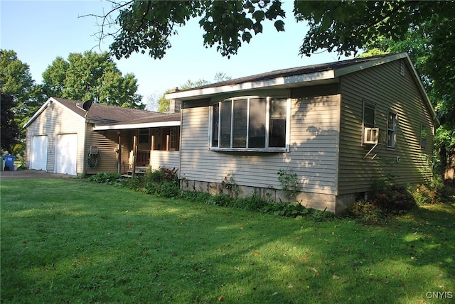 view of front of house featuring a garage and a front lawn