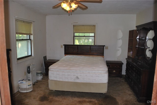 carpeted bedroom with ceiling fan