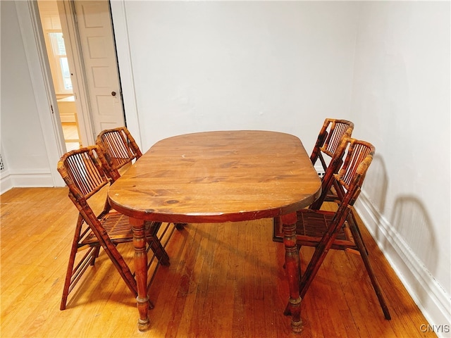 dining room with hardwood / wood-style floors