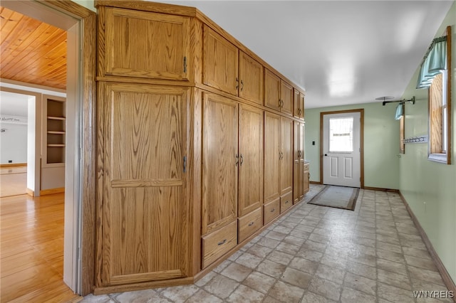 mudroom featuring light hardwood / wood-style floors and wood ceiling