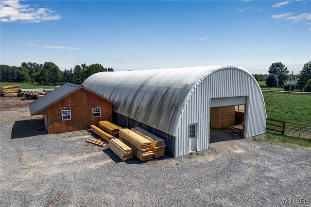 view of outbuilding featuring a rural view