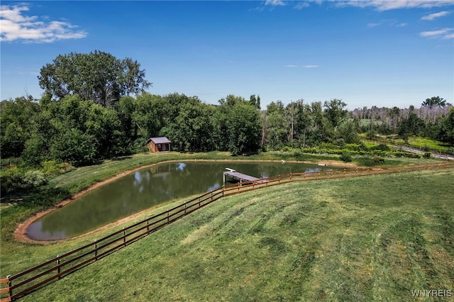 view of community with a yard and a water view