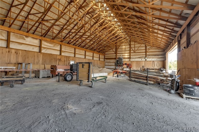 miscellaneous room with high vaulted ceiling