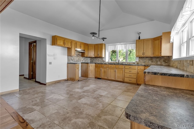 kitchen with lofted ceiling, tasteful backsplash, and light tile patterned floors