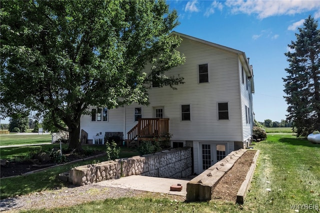 back of house with a yard