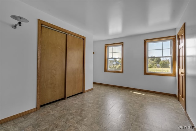 unfurnished bedroom with a closet