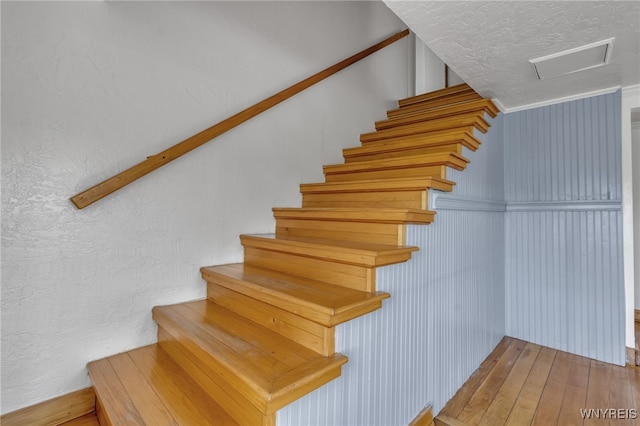 staircase featuring hardwood / wood-style floors