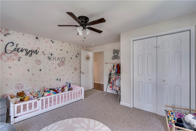 carpeted bedroom featuring ceiling fan and a closet