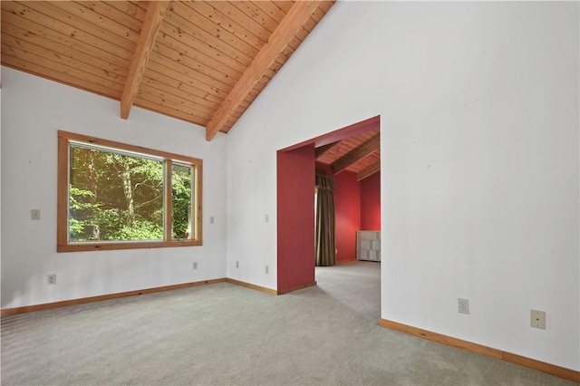 carpeted empty room with wood ceiling, baseboards, beam ceiling, and high vaulted ceiling
