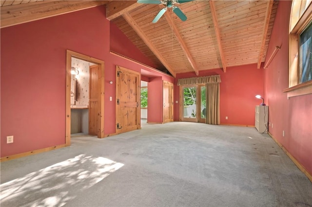 unfurnished living room with a ceiling fan, wooden ceiling, carpet floors, beam ceiling, and high vaulted ceiling