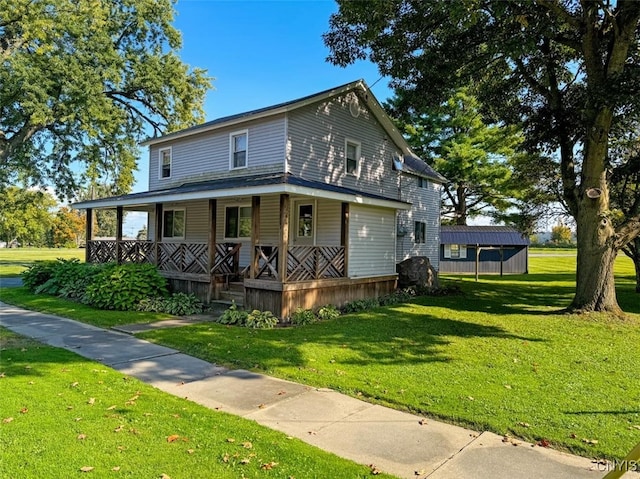 view of front of property featuring a front yard and covered porch