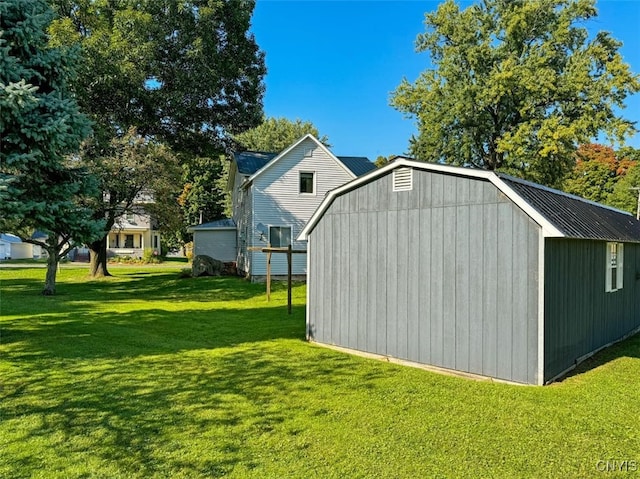 view of outdoor structure with a yard