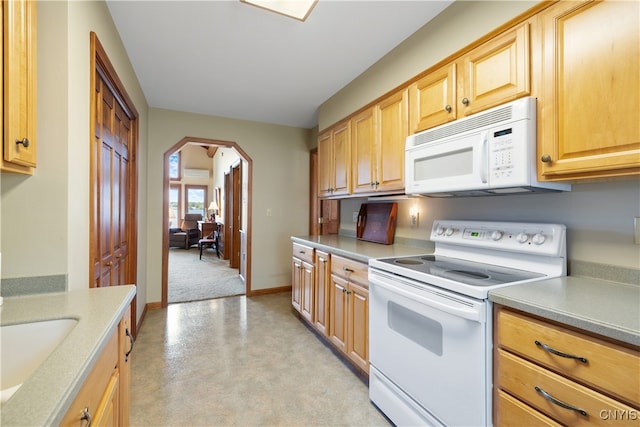 kitchen with white appliances and sink