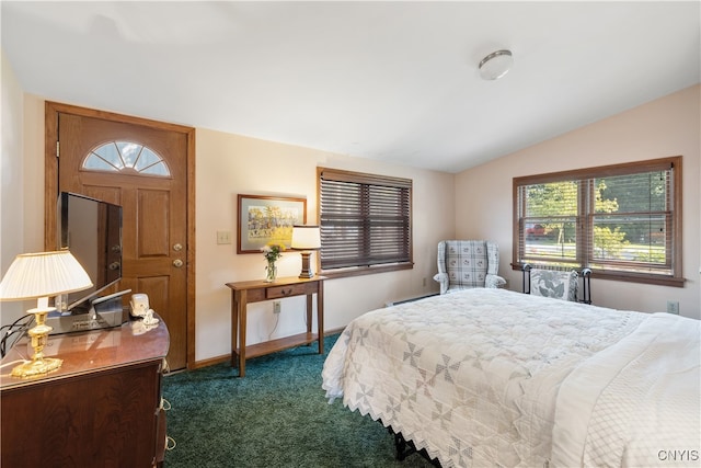 carpeted bedroom featuring lofted ceiling