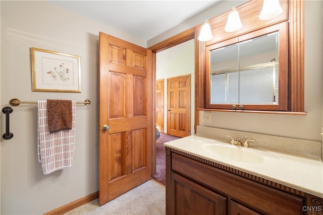 bathroom with vanity and walk in shower