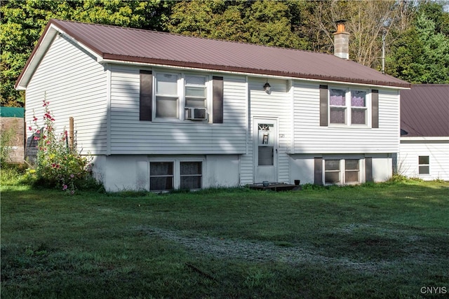 view of front of home featuring a front yard and cooling unit