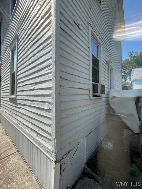 property exterior at dusk with cooling unit