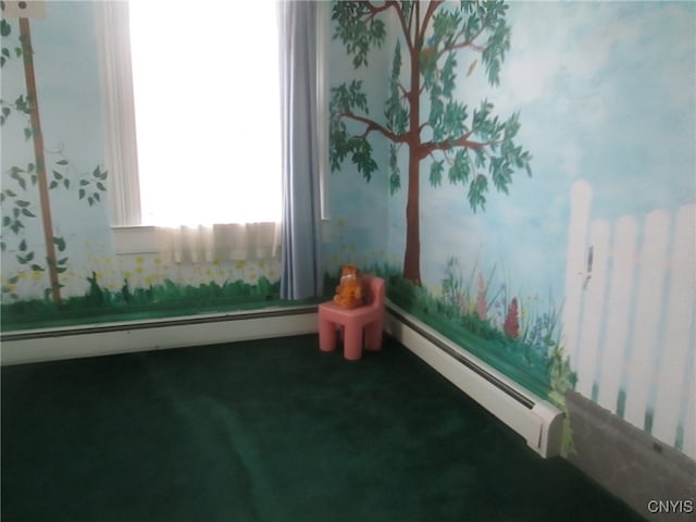 carpeted spare room with a baseboard radiator