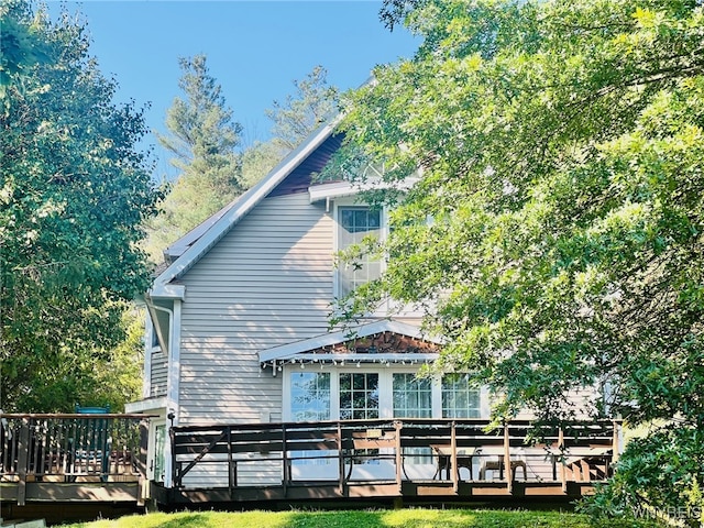 back of house featuring a deck