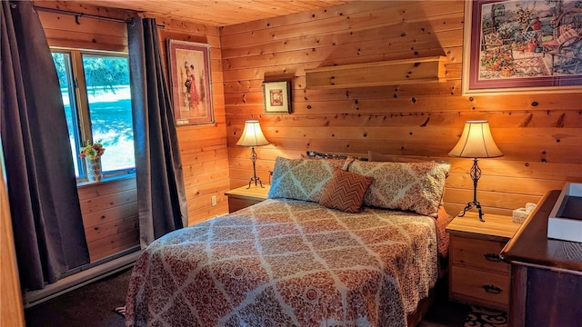 bedroom with wooden ceiling, multiple windows, and wooden walls