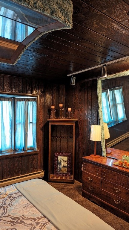 bedroom with wood ceiling and wooden walls