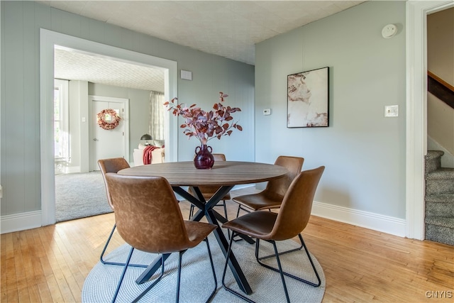 dining area with light wood-type flooring