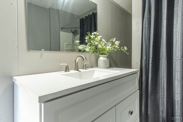 bathroom featuring vanity and a shower with shower curtain