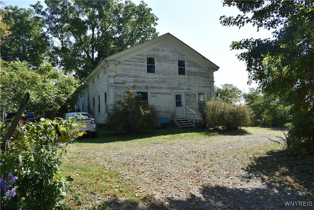 view of home's exterior featuring a lawn