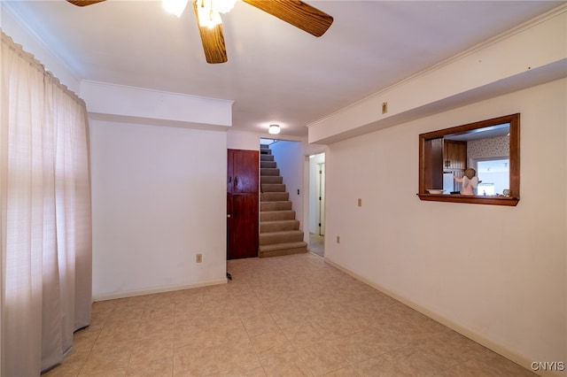 interior space featuring ceiling fan and crown molding